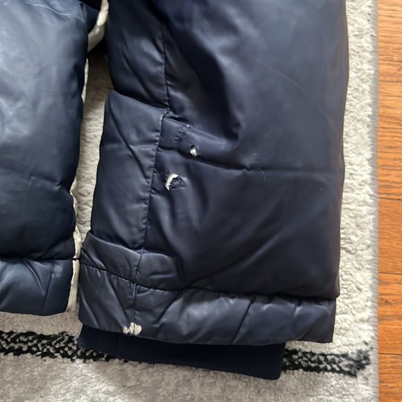 Tommy Hilfiger winter jacket with a couple tears. - Picture 2 of 8